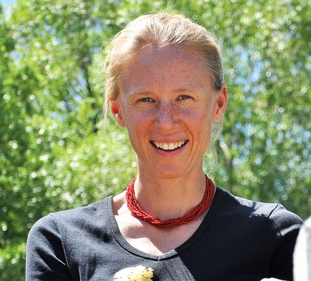 Libby Foster smiling in an outdoor setting.