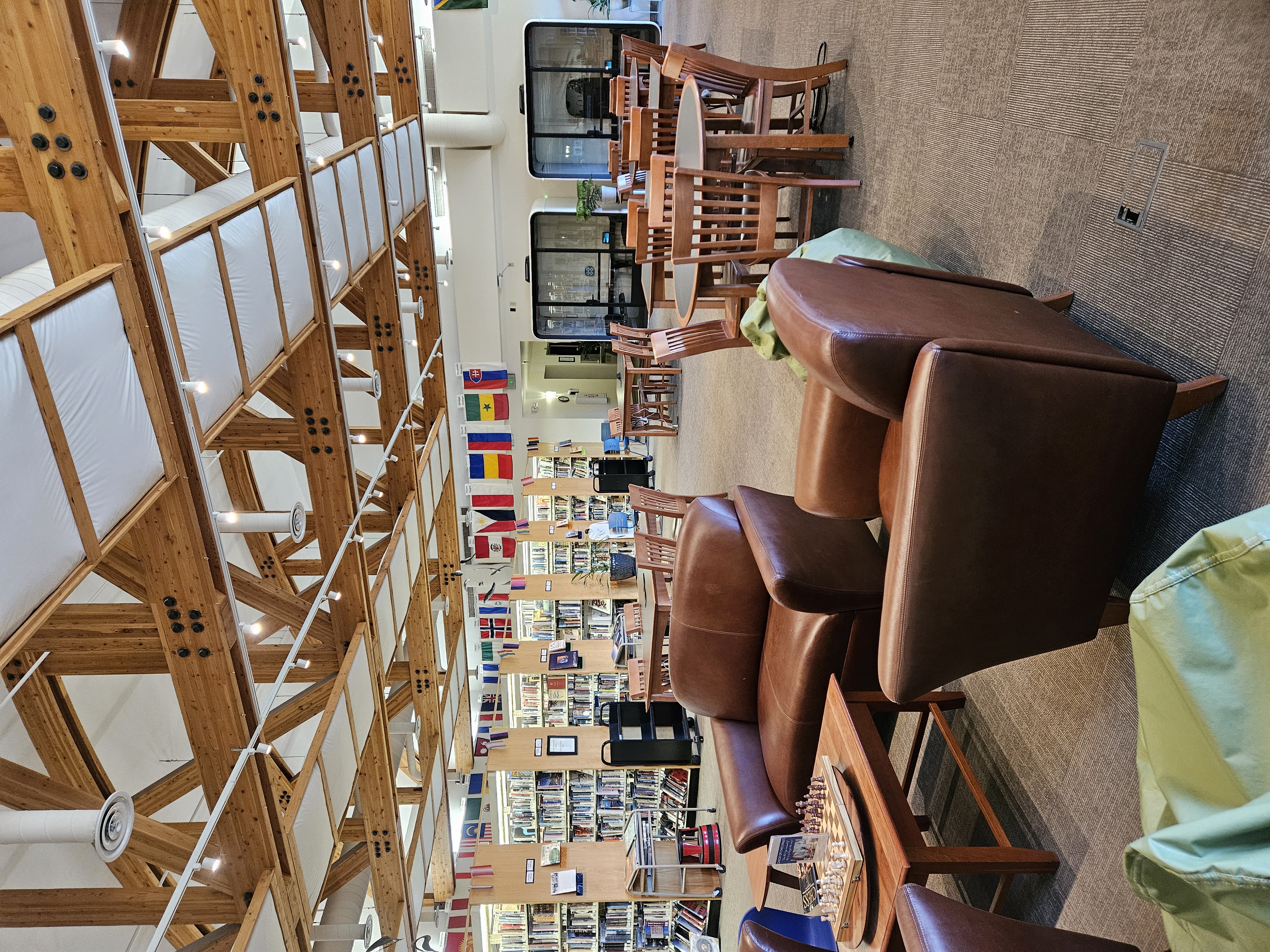 A cozy seating area with sofas in a library.